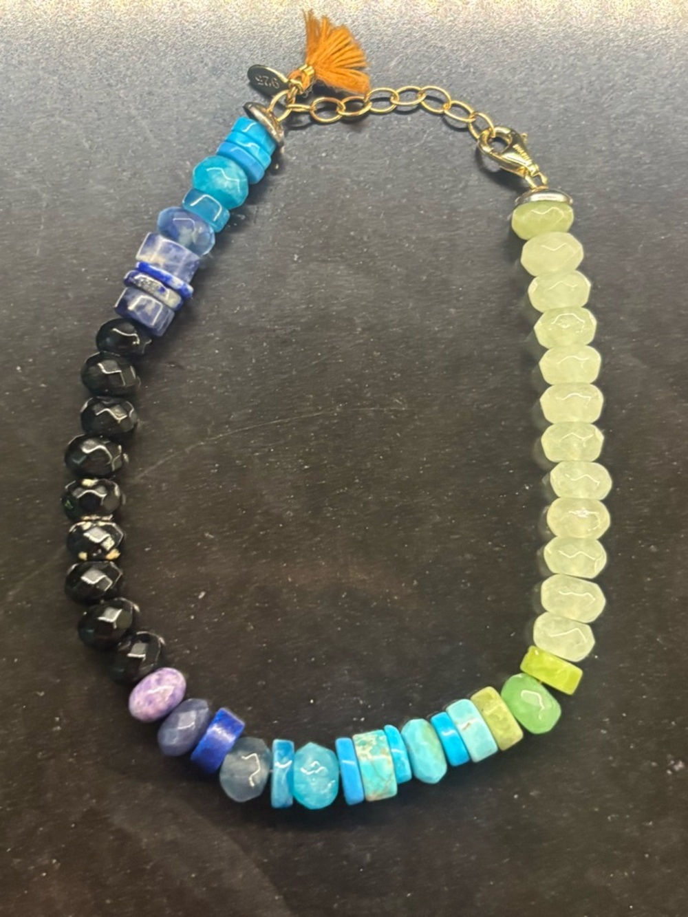 SHASHI Turquoise, Lime & Black Beaded Bracelet with Orange Tassel
